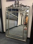 An sectional silvered bevelled mirror
