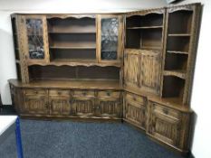 A Jaycee Oak four section corner display cabinet