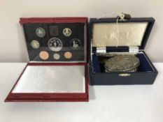 A boxed silver comb and hand brush with a boxed Royal Mint 1993 proof coin set