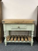 A painted pine butcher's block fitted with a drawer