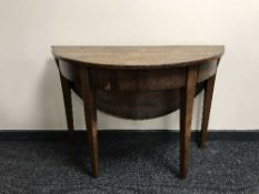 A Georgian mahogany d-shaped flap sided table