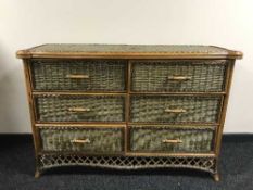 A bamboo and wicker six drawer low chest