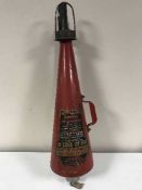 A vintage Minimax fire extinguisher and wall mount bracket