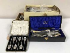 A tray of boxed and unboxed cutlery and a mirrored stand