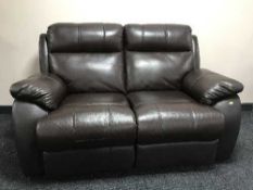 A manual reclining two seater brown leather settee