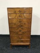 A walnut seven drawer music chest