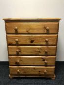 A pine five drawer chest