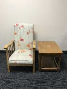 A mid 20th century oak adjustable armchair and coffee table