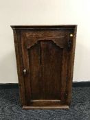 A Victorian oak hanging corner cabinet