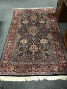 A Persian Kirman designed rug with indigo field