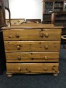 A shaped pine four drawer chest