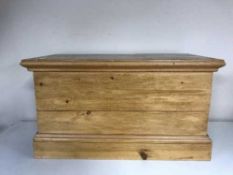 A small stripped pine blanket box