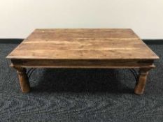 A pine rectangular coffee table with metal mounts and pair of matching lamp tables