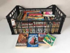 Three boxes of paperback books relating to Hollywood and the film industry, News of the World,