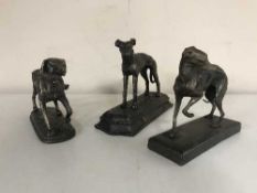 Three cast metal figures - Dogs
