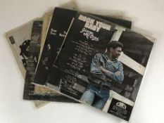 A box of LP records and 45's - U2, The Beatles,