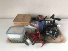 A Shakespeare two pieces fishing rod, a telescopic rod, rod stand, tray of fishing reels,