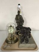 A tray of anniversary clock, spelter table lamp,