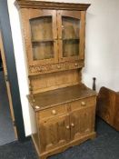 A stained pine glazed door kitchen dresser