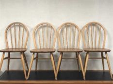 Four Ercol elm dining chairs