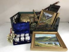 A basket of brass bed warming pan, mug tree, three oils on panels, marble eggs,