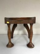 An antique mahogany stool