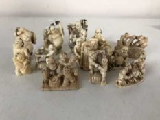 A group of twelve Japanese netsukes depicting figures