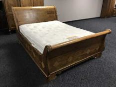 A 5' mixed wood contemporary sleigh bed together with Windsor Bed Company interior