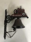 A cast metal bell on wall bracket - Tractor