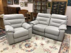 A two-seater electric reclining settee together with matching armchair