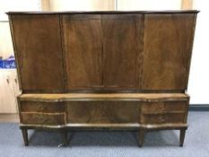 A walnut four door sideboard