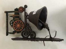 A cast metal bell on bracket - Traction engine