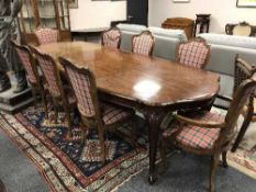 A French style mahogany extending dining room table, 290cm fully extended,