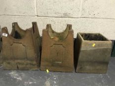 Three chimney pots together with a terracotta planter