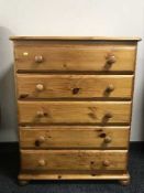 A pine five drawer chest