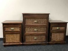 A stained pine wicker fronted three drawer chest and pair of bedside stands