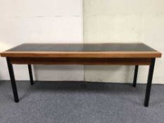 A teak leather topped cabinet and a teak console table on metal legs