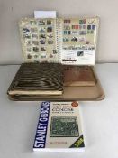 Four stamp albums and a Stanley Gibbons stamp catalogue