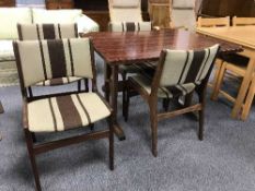 A rosewood effect dining table and four teak chairs