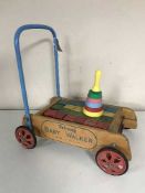 A Triang baby walker together with a Merrit toy