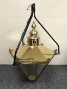 A large brass hanging lantern