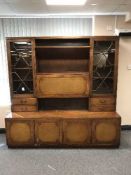 A mahogany cocktail display cabinet with cupboards beneath