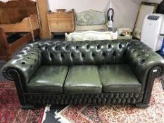 A green button leather Chesterfield settee