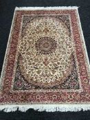 A fringed Persian Kashan rug 190cm x 140cm