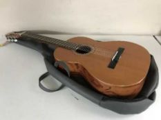 An Antonio Sanchez acoustic guitar in carry bag