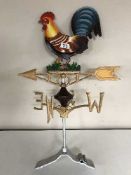 A cast metal cockerel weather vane