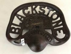 A cast metal Blackstone tractor seat