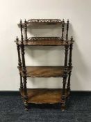 A Victorian rosewood four tier what-not stand