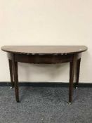A Georgian mahogany d-shaped table
