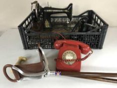 A Singer hand sewing machine, two bakelite telephones, telephone,